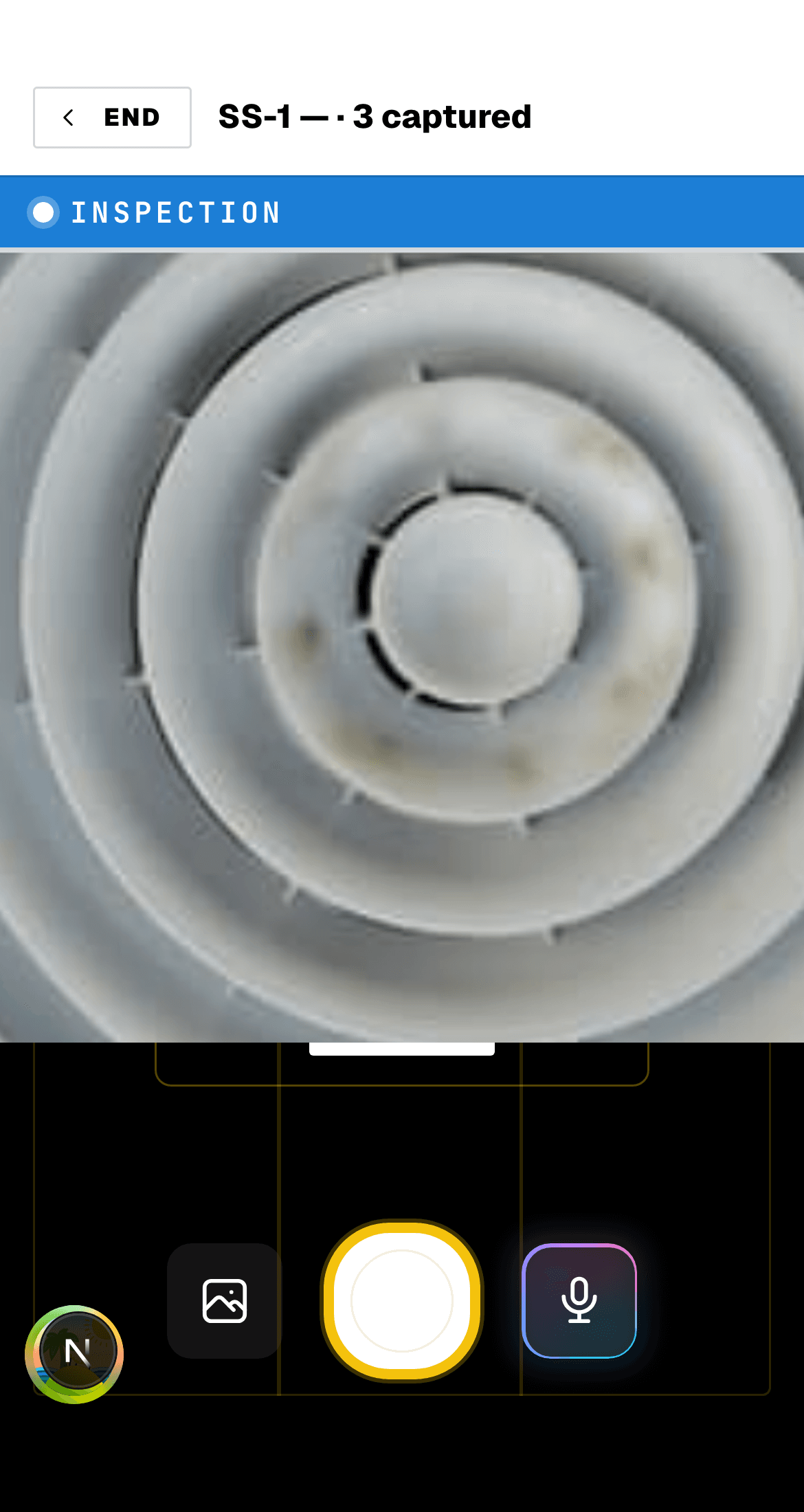 Snap Job Reports field app on a phone, showing the inspection camera capturing a return-air vent, with the voice-capture microphone alongside the shutter.